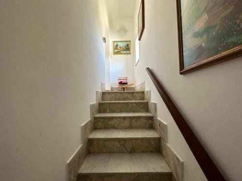 a stairway with a painting on the wall at Baia dei turchi locazione turistica in Realmonte
