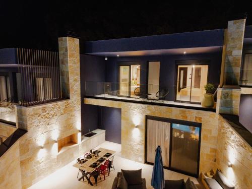a living room with a couch and a table at Villa Varco in Paleros
