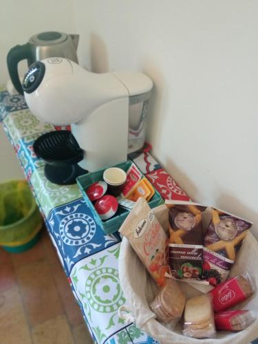 a table with a mixer and some food on it at All'Ombra di San Damiano in Assisi