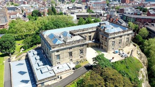 an aerial view of a large building on a hill at G-Floor Flat with 2 beds, 2 bathrooms, slips 4-6 in West Bridgford