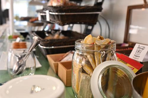 a glass jar filled with snacks on a table at HB Torrevieja in Torrevieja