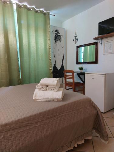 Postel nebo postele na pokoji v ubytování B&B Albachiara