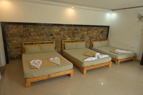 Postel nebo postele na pokoji v ubytování Kaadgal Resort