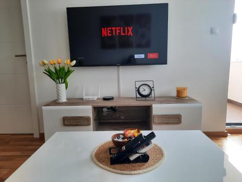 a toy gun sitting on a table in a living room at Apartman Petrovic in Doboj