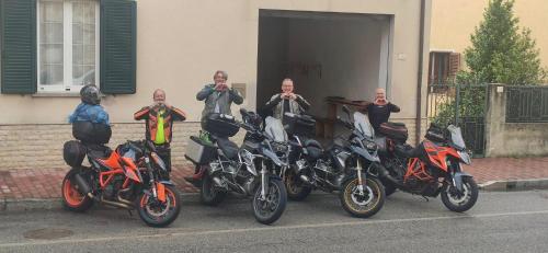 a group of motorcycles parked in front of a building at Locanda 130 in Fonni