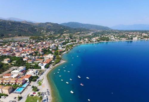 an aerial view of a beach with boats in the water at Luxury Beach House 3 Br, AC in Selianitika