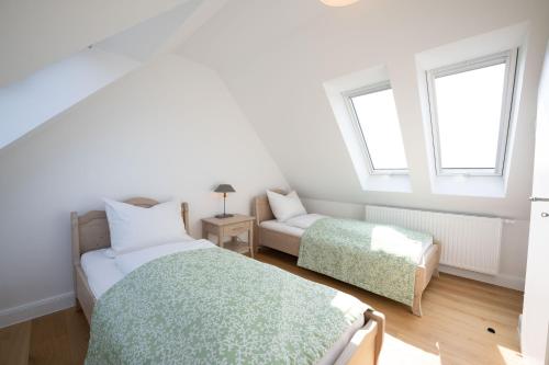 Postel nebo postele na pokoji v ubytování Ferienwohnung "Mühlenhof 3" - Gut Kletkamp