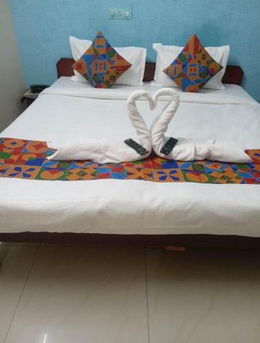 Un ou plusieurs lits dans un hébergement de l'établissement Hotel Singhasan House