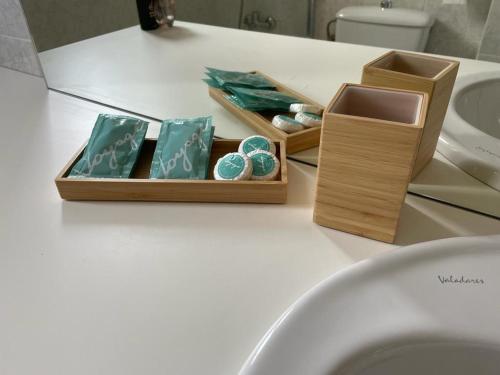 a wooden box with stones on a bathroom counter at Apartament La Mata Torrevieja in Torrevieja