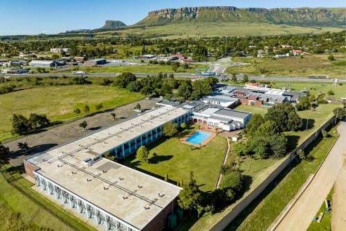 an aerial view of a building with a pool at African Sky Harrismith Inn in Harrismith