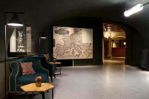 a room with a large map on the wall at Hotel Elephant in Bressanone