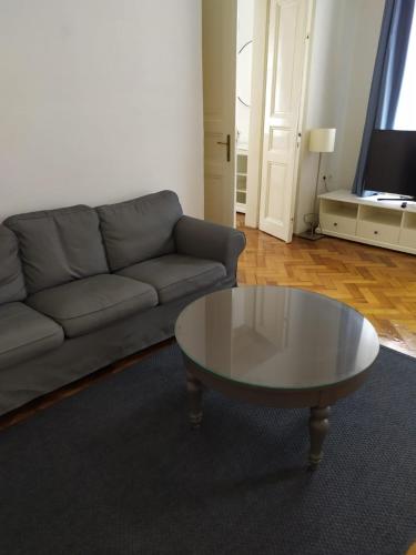 a living room with a couch and a coffee table at Týnská ulicka 2 - Cathedral View Apartment in Prague