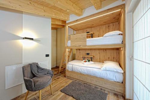 Postel nebo postele na pokoji v ubytování Lux Domotic Apt-Chalet Dolomites