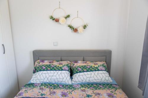 a bedroom with a bed with a heart on the wall at Karlo’s apartments in Split