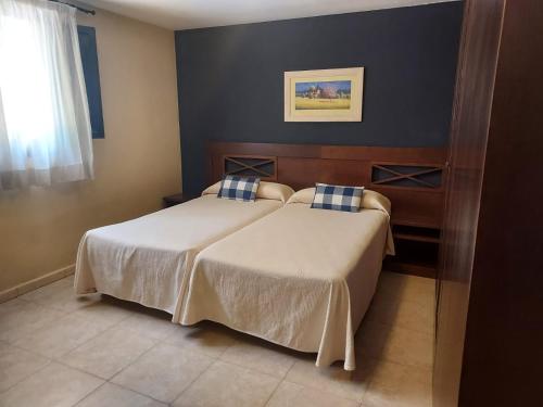 Llit o llits en una habitació de HOTEL MASIA EL MOLINETE