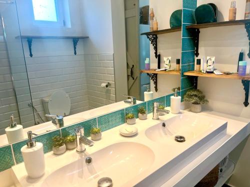 a bathroom with a sink and a mirror at Bohemian Eco Lodge at lake Balaton in Kisapáti