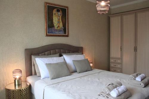 Postel nebo postele na pokoji v ubytování Ika apartment
