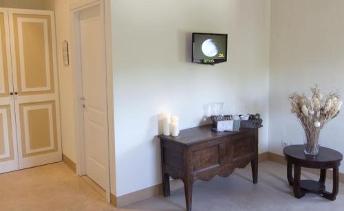 a room with a wooden desk and a table with candles at Tenuta San Marcello in San Marcello
