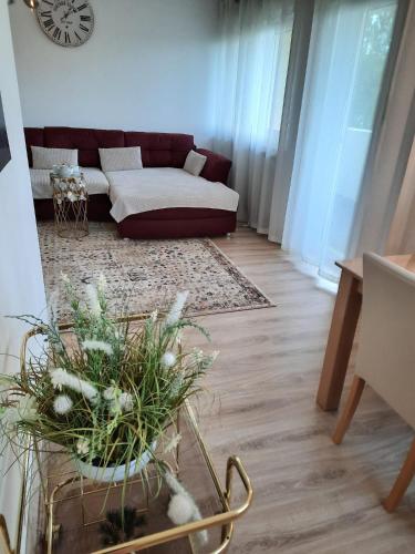 a living room with a couch and a table at Moderne 3Zimmer Wohnung, in Königsbrunn bei Augsburg in Königsbrunn