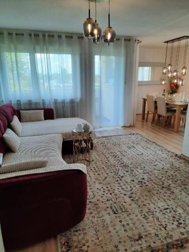 a living room with a couch and a table at Moderne 3Zimmer Wohnung, in Königsbrunn bei Augsburg in Königsbrunn
