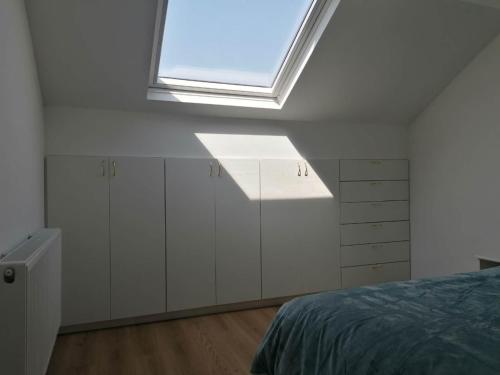 Ένα ή περισσότερα κρεβάτια σε δωμάτιο στο La Maison Heureuse
