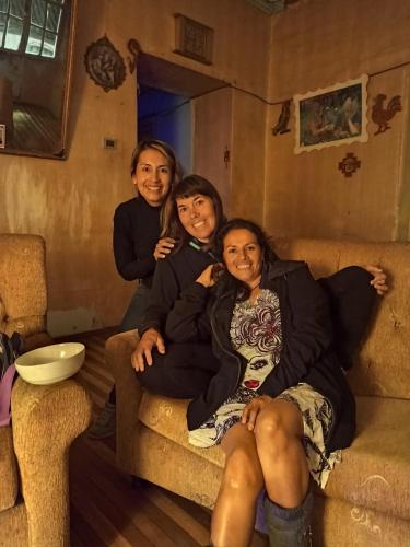 a group of three women sitting on a couch at CASA VIEJA del Centro Historico in Quito