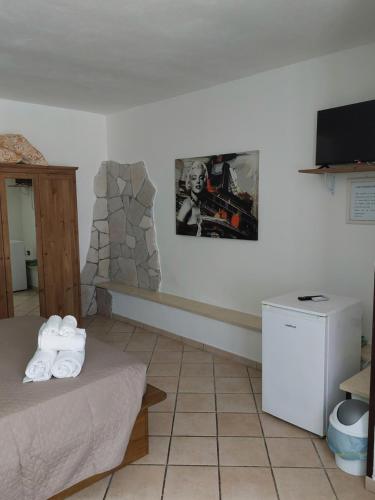 a room with a bed and a fireplace at B&B Albachiara in Otranto