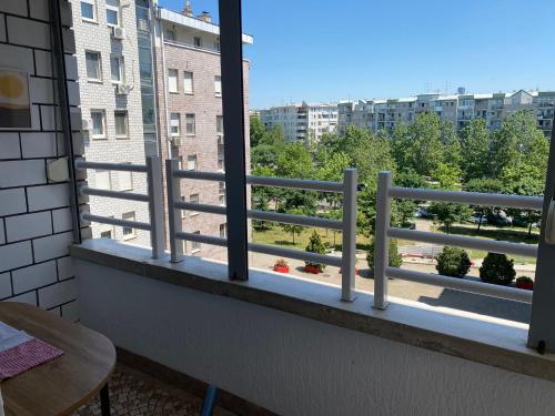 a balcony with a white railing and a view at Arena 011 in Novi Beograd