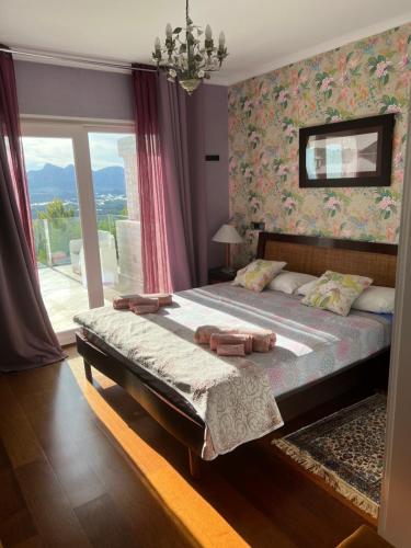 Postel nebo postele na pokoji v ubytování Villa Aleandra con Maravillosas Vistas al mar!