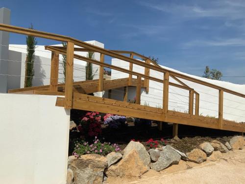 a wooden deck on the side of a building at Quinta da Ema in Santo Estêvão das Galés