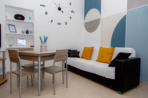 a living room with a couch and a table at Piave77 in Bagheria