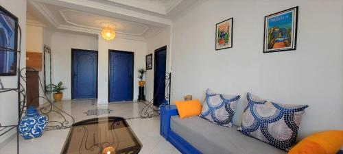 a living room with a couch and a table at CASA ZOUINA in Agadir