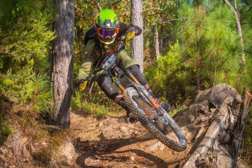 a person riding a mountain bike on a trail at La ruelle des 2 vallées in Arreau