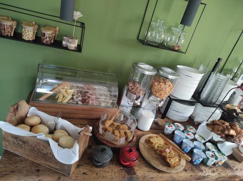 a table topped with lots of different types of food at Agriturismo ValFraja in Cembra