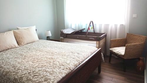 a bedroom with a bed and a desk and a piano at MyHome Olhão in Olhão