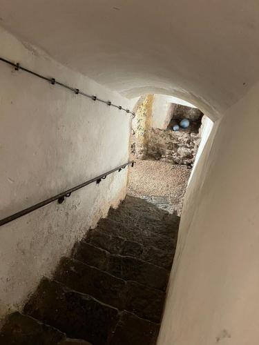 a tunnel with a staircase in an old building at Kaps Wohnen in Saalfelden am Steinernen Meer