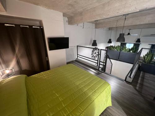 a bedroom with a green bed in a room at Residence Star in Turin