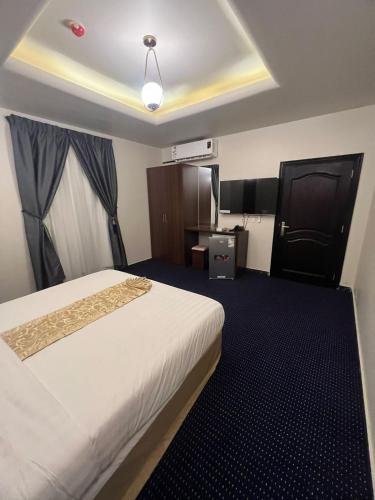 Una cama o camas en una habitación de Kada Suites