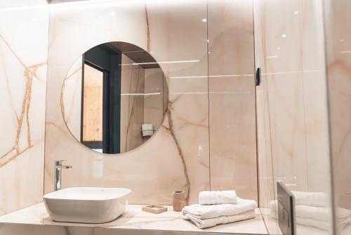 a bathroom with a sink and a mirror at Wine Paradise - Glamping resort in Marezige