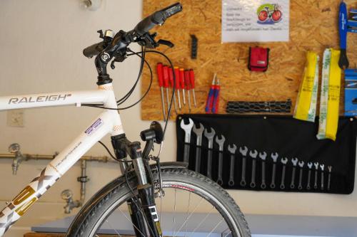 a bike parked in a room next to a wall at Hotel Chesa Spuondas in St. Moritz