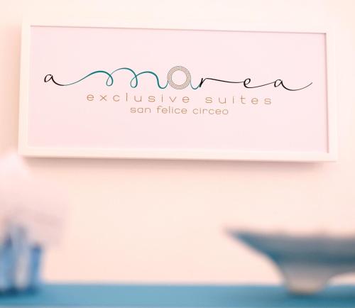 a sign for an exclusive suites san false creek at AMAREA Exclusive Suites in San Felice Circeo