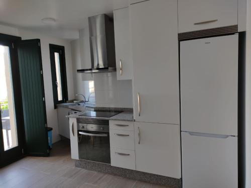 Kuchyň nebo kuchyňský kout v ubytování Apartamento Salvadas