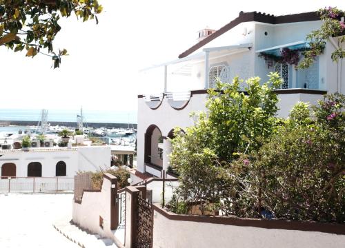 a house with a view of the harbor at AMAREA Exclusive Suites in San Felice Circeo