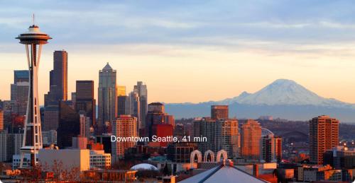 a view of a city with a mountain in the background at Water View, Best Area, 2 Bedrooms, WD, Jacuzzi Bath, New Carpet, Balcony, View, 825sf in Tacoma