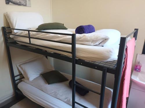 a couple of bunk beds in a room at Princes Street Hostel in Edinburgh