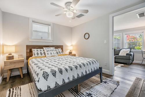 a bedroom with a bed and a ceiling fan at The Urban Nest in Tampa