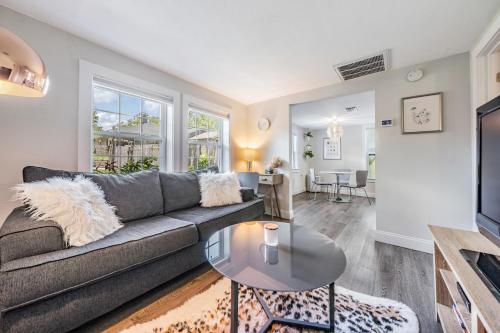 a living room with a couch and a table at The Urban Nest in Tampa