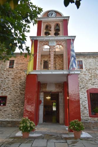 a building with a clock tower on top of it at Panorama Studio Afetes in Afétai
