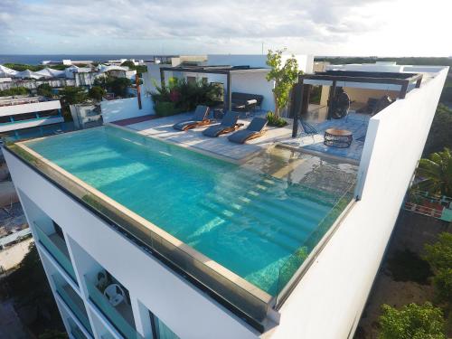 a swimming pool on the roof of a building at RIVA Playa Sur in Playa del Carmen