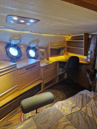 a room with a bed and a desk and a chair at Ship Windö in Södertälje